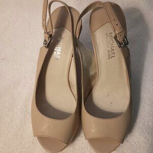 Michael Kors Peep-toe wedge heel slingback sandals.